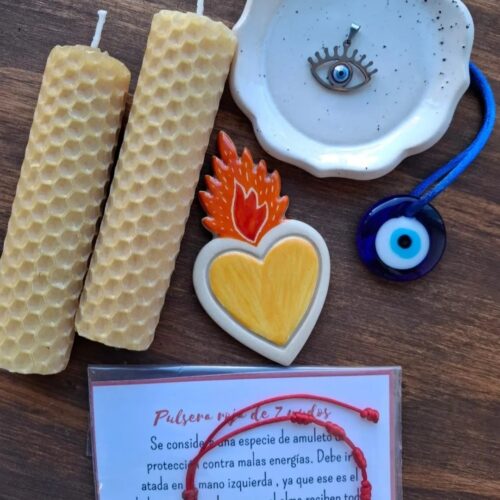 “Un corazón que ama, una vela que alumbra, un ojito que cuida.